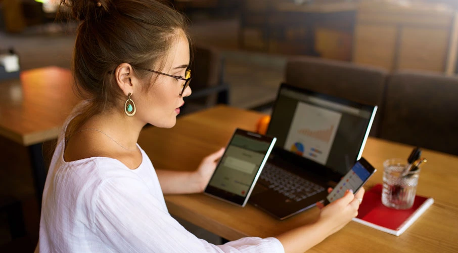 Woman using multiple internet devices