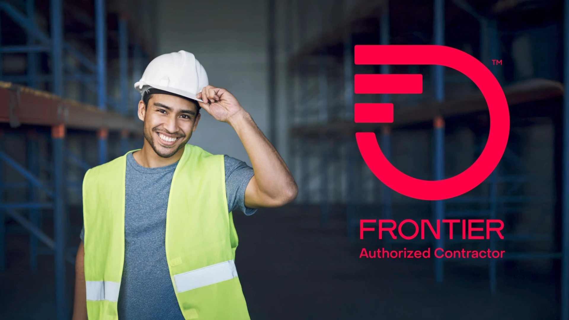 Frontier field tech with warehouse in back with Frontier logo off to side